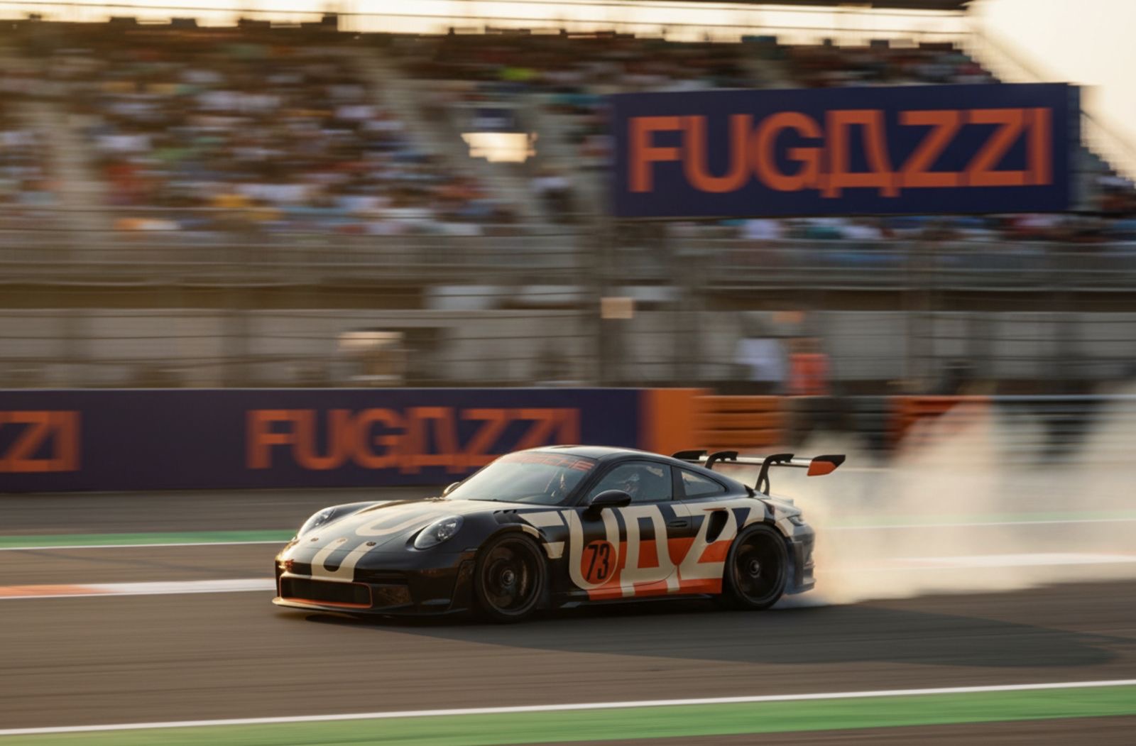 LOTR race car passing Fugazzi trackside branding