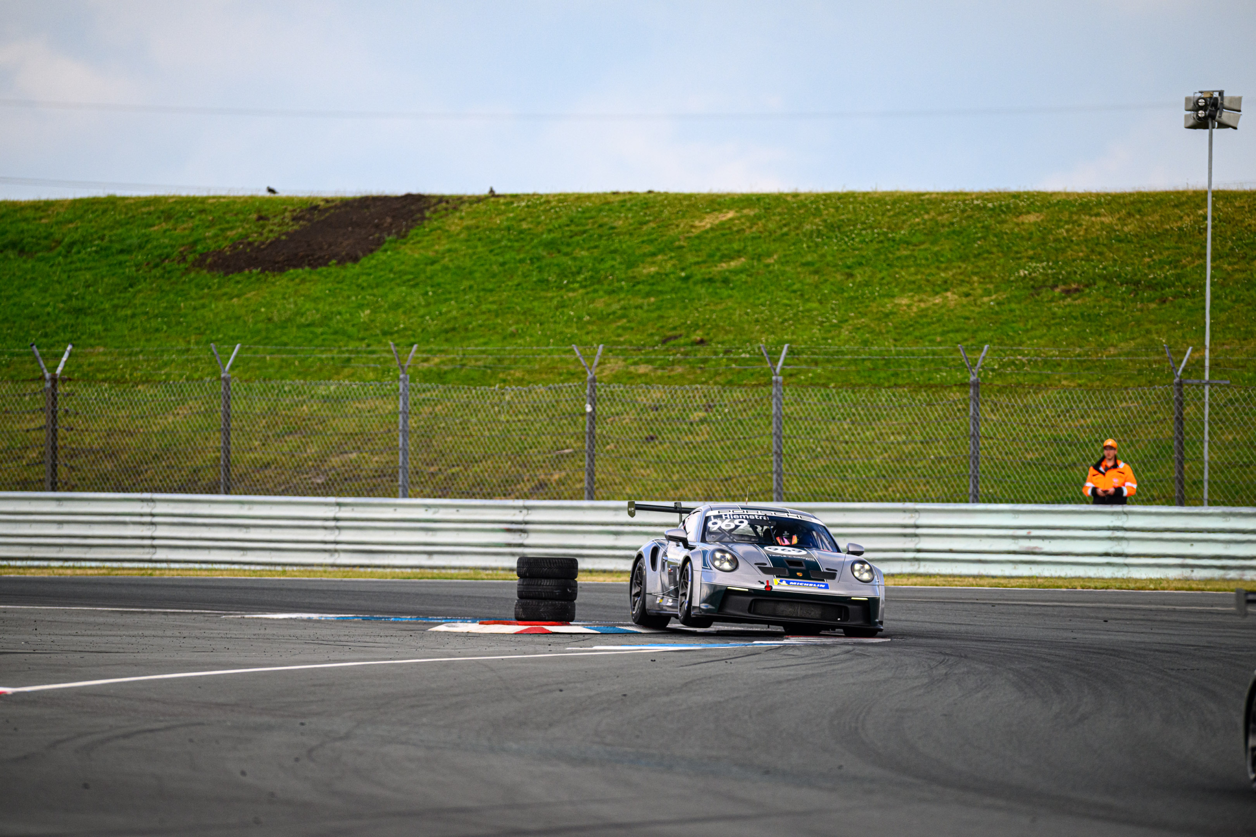 Triple&Crown Porsche race car on circuit at Assen