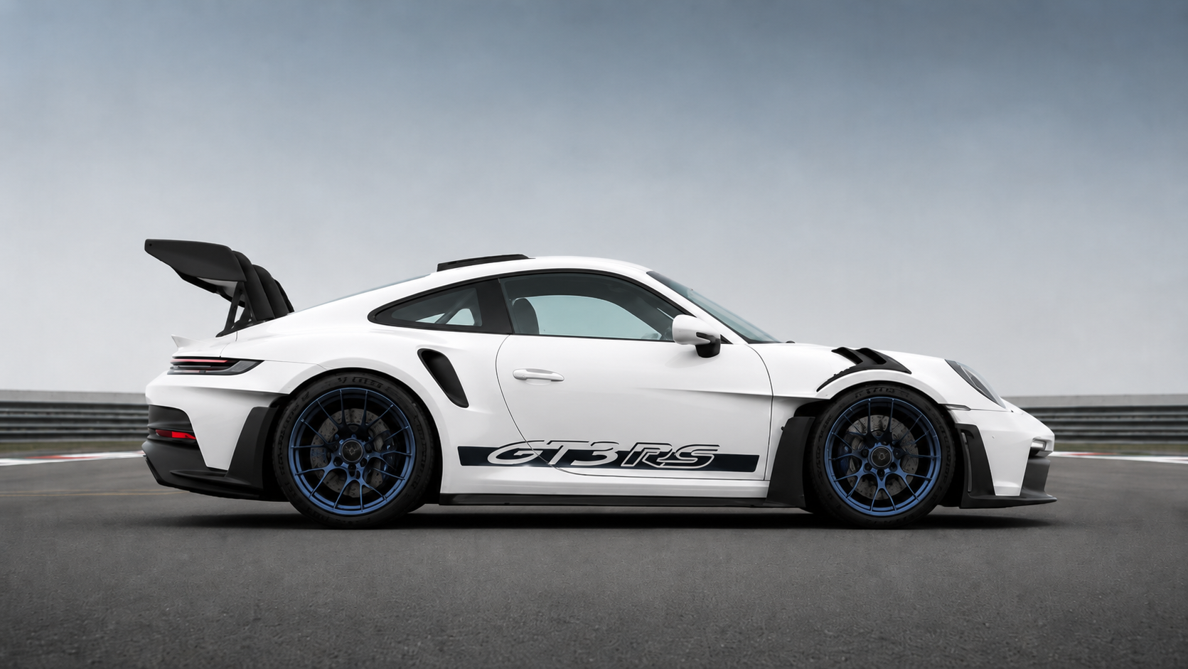 White Porsche 911 GT3 RS (992) in side profile